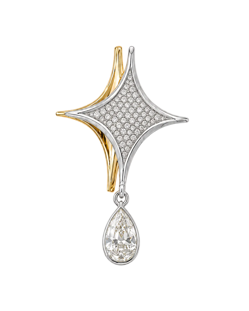 A two-tone star-shaped brooch with a pavé diamond center, gold curved accents, and a dangling pear-cut diamond, shown on a light cream background.